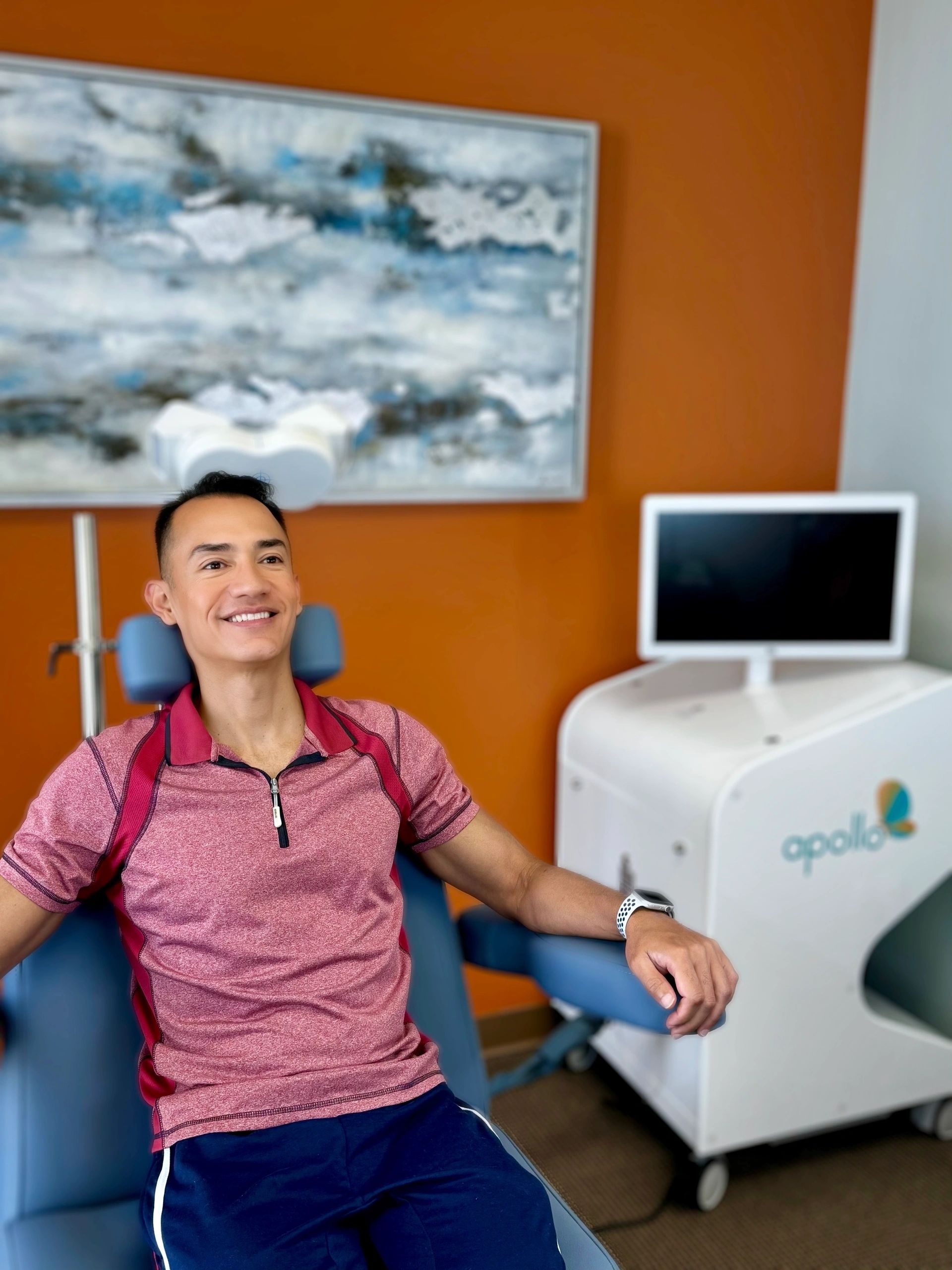 Patient receiving IV ketamine therapy in comfortable medical chair